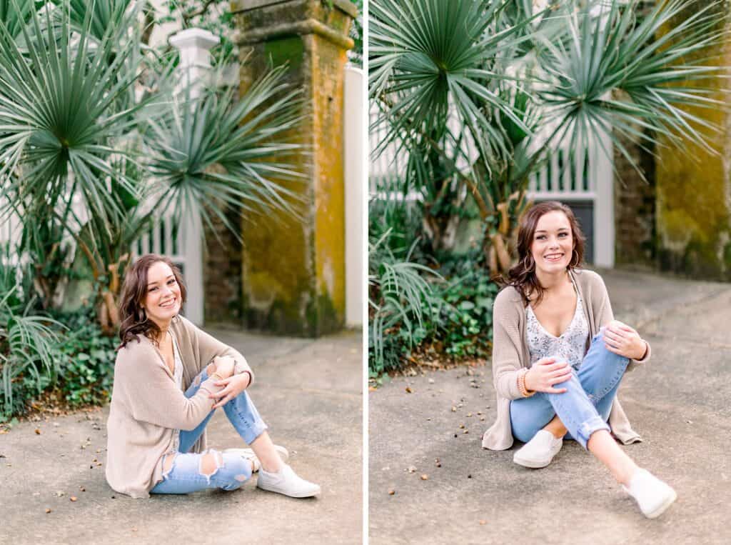 girl sitting in front of palm trees by Charleston SC Senior Photographer