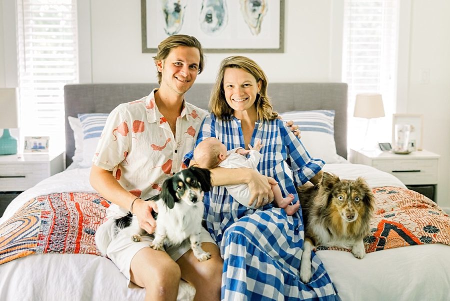 Family photos with pups during newborn session in Miami area home
