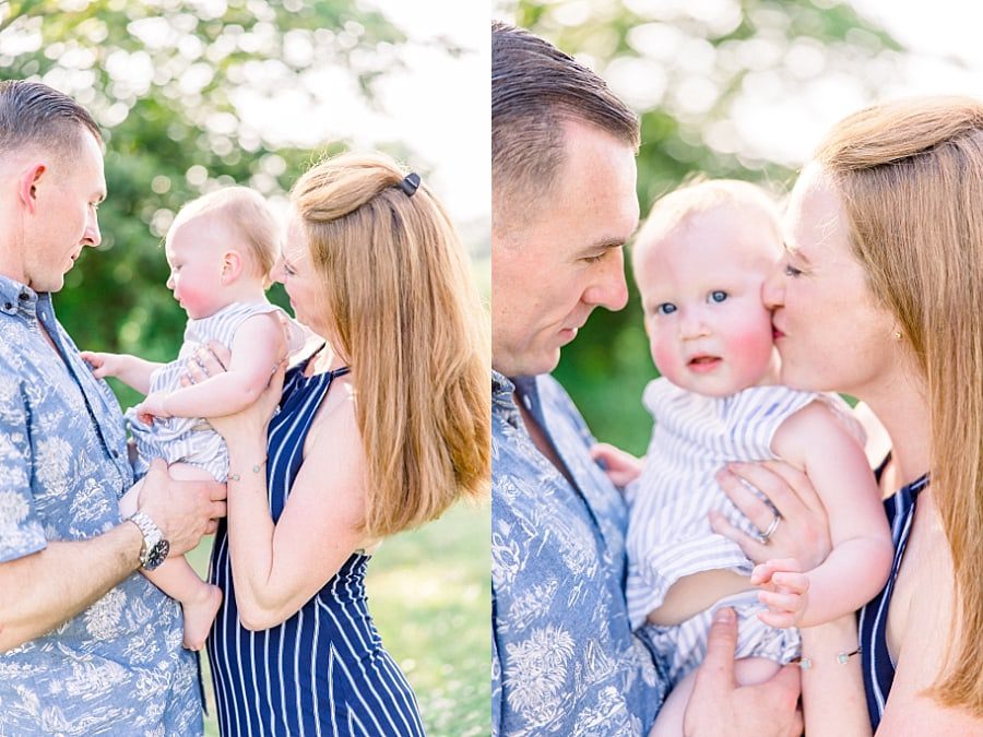 Parents snuggling one year old daughter during Boca Raton area family photo shoot