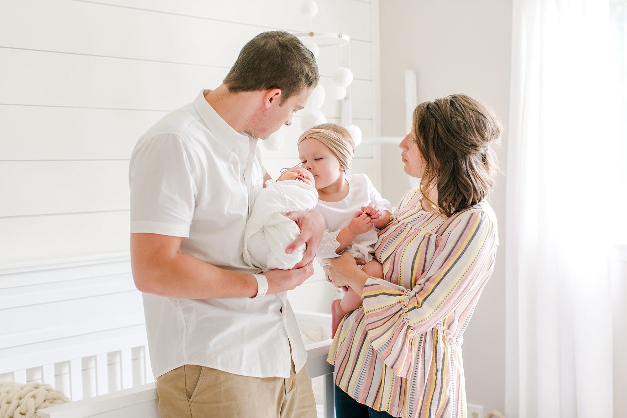 Boca Raton new family of four with two young daughters during newborn photos 