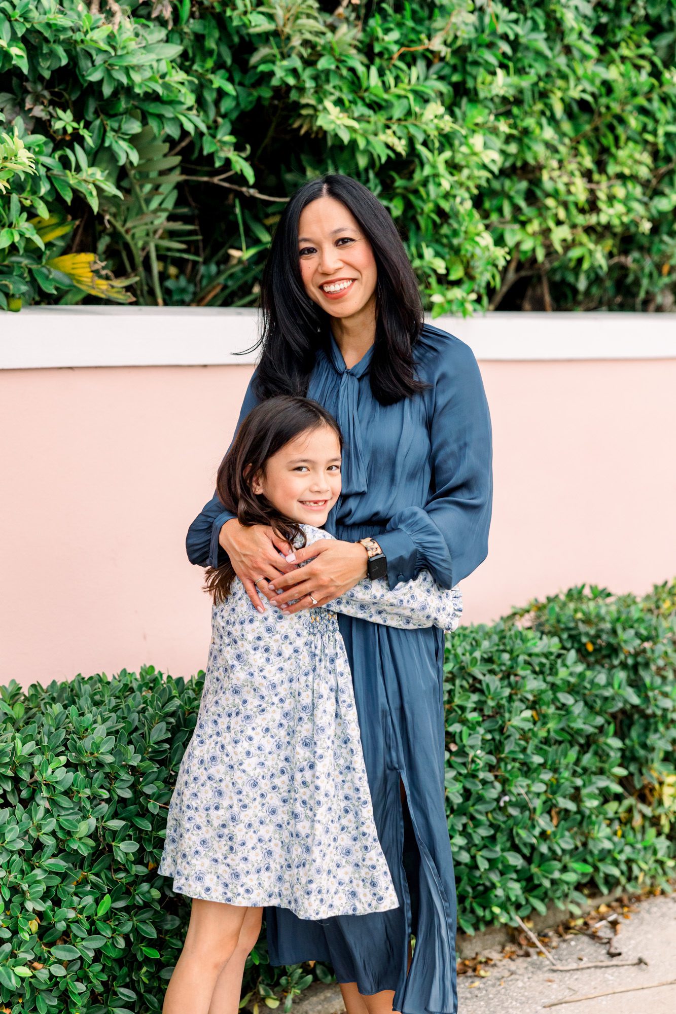 mom hugging daughter by west palm beach family photographer
