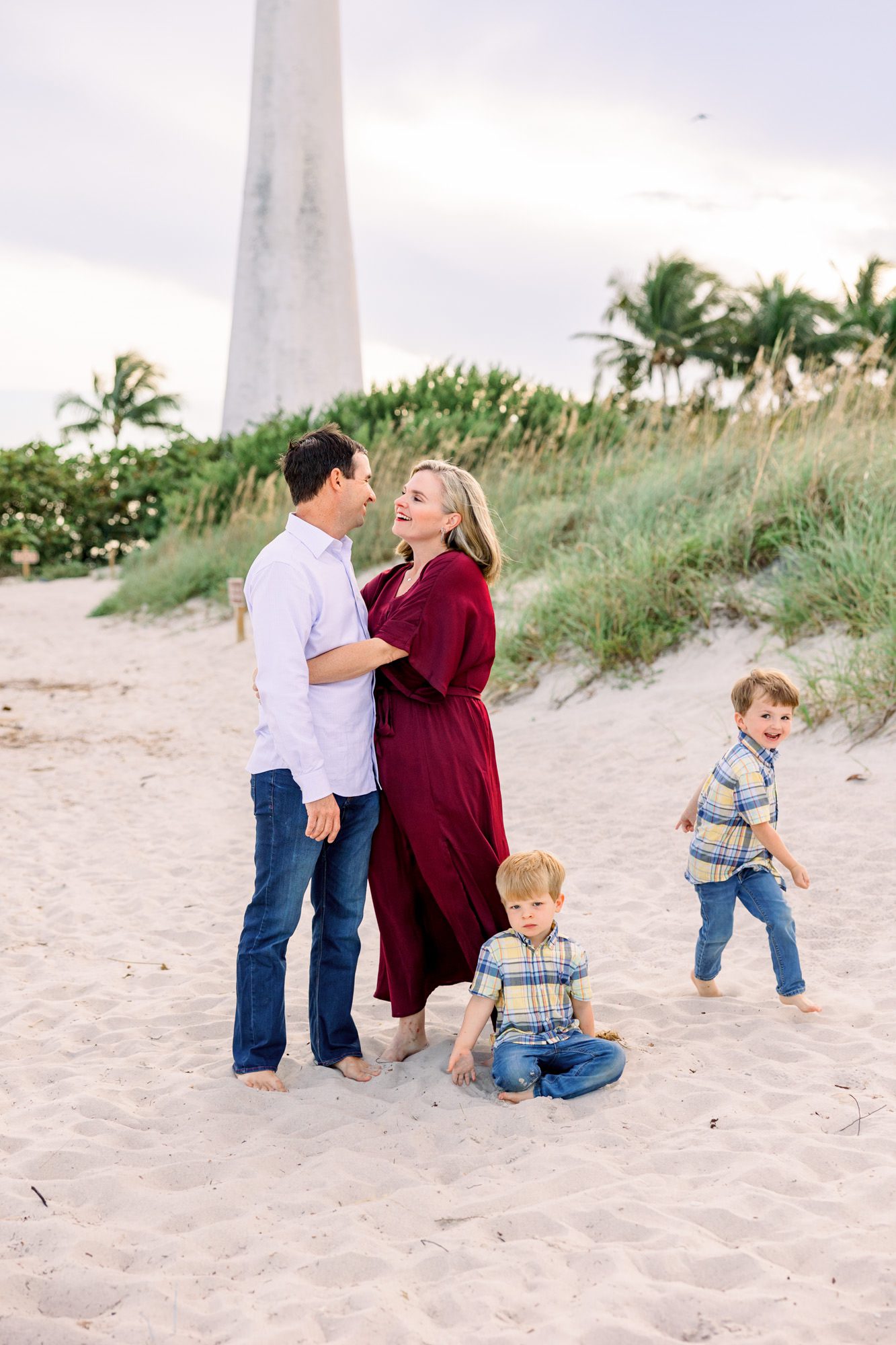 Family on beach at Florida lighthouse